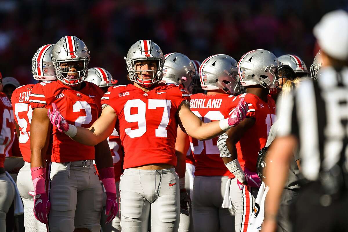 COLUMBUS, OH - OCTOBER 7: Nick Bosa #97 of the Ohio State Buckeyes asks for an explanation on a penalty from the referee during a game against the Maryland Terrapins at Ohio Stadium on October 7, 2017 in Columbus, Ohio. ~~