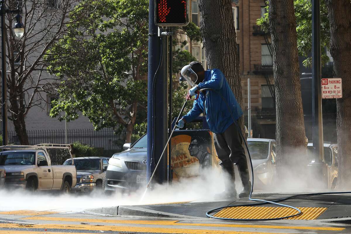 Pressure washing from the Tenderloin Community Benefit District sen on Leavenworth near Turk streets on Wednesday, April 17, 2019, in San Francisco, Calif.