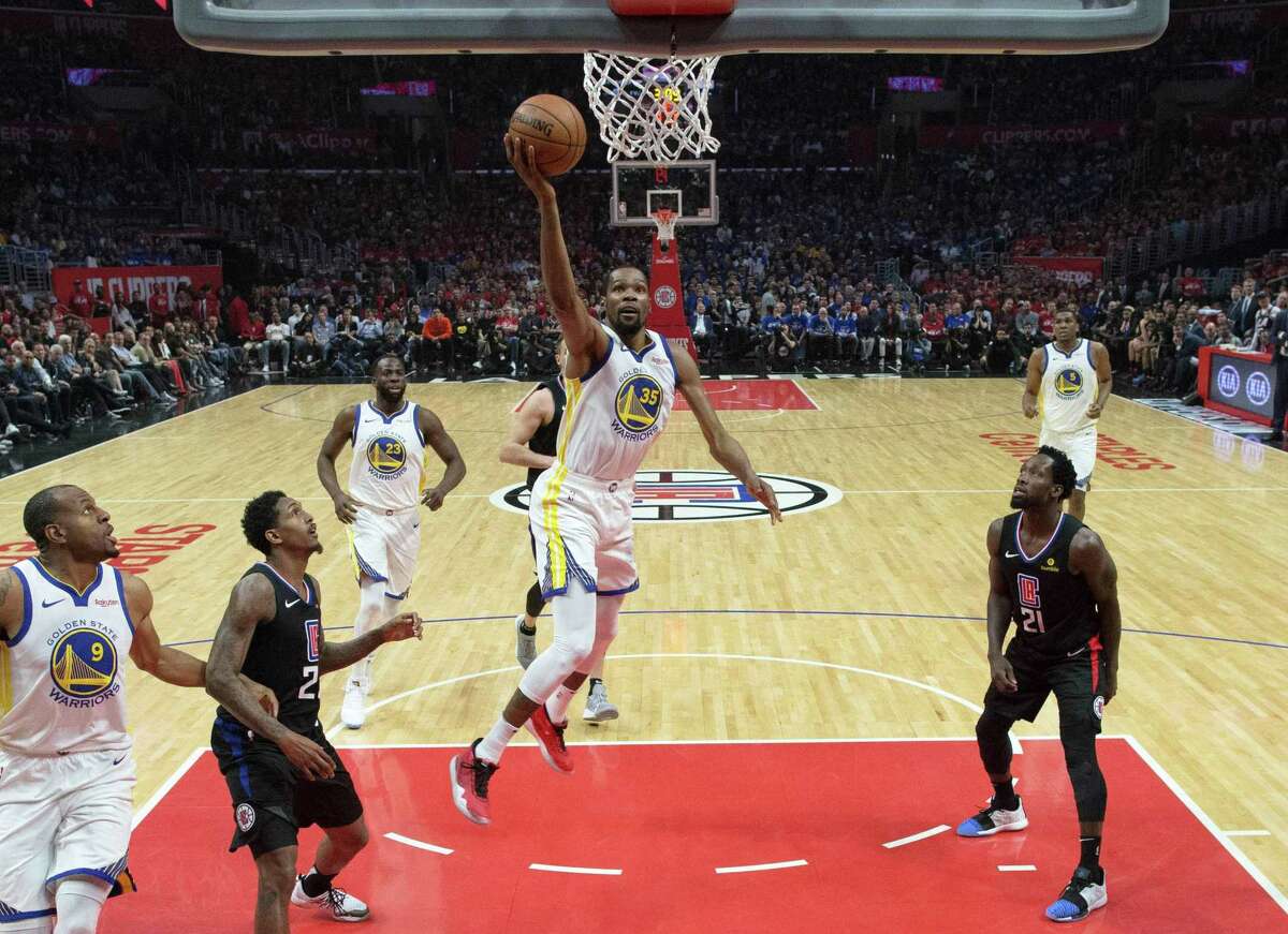 Kevin Durant (35) drives to the basket In the first half as the Golden State Warriors played the Los Angeles Clippers in Game 3 of the First Round of the NBA Playoffs at Staples Center in Los Angeles, Calif., on Thursday, April 18, 2019.