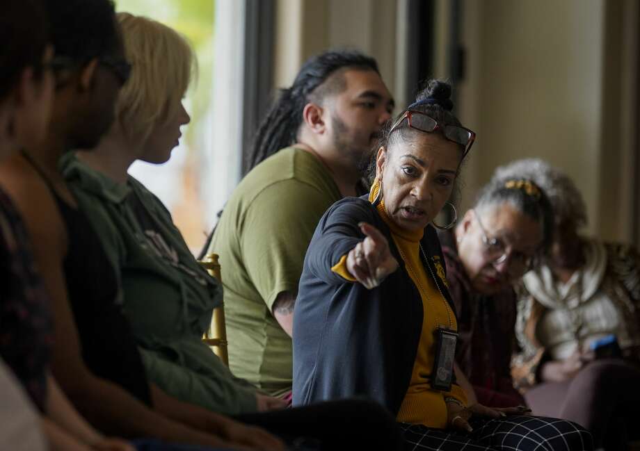 Kathryn Griffin, center, of the Harris County Precinct 1 Constable's office, leads a support group for ex-prostitutes and sex-trafficking victims at a mansion in Houston. Griffin, 59, calls herself an "ex-ho" and says it took her 22 rehabs to shake her crack addiction. Photo: Godofredo A. Vásquez/Staff Photographer