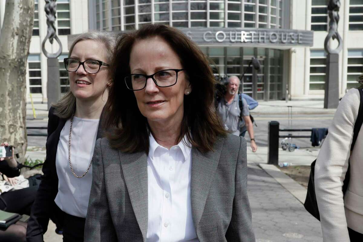 Kathy Russell, a member of NXIVM, an organization charged with sex trafficking, leaves Brooklyn Federal Court April 8, 2019, in New York. Federal prosecutors on Thursday asked a judge to sentence Russell, the longtime NXIVM bookkeeper,six months to a year behind bars for  crimes that include presenting a false visa on behalf of one of cult leader Keith Raniere’s future “slaves.”
