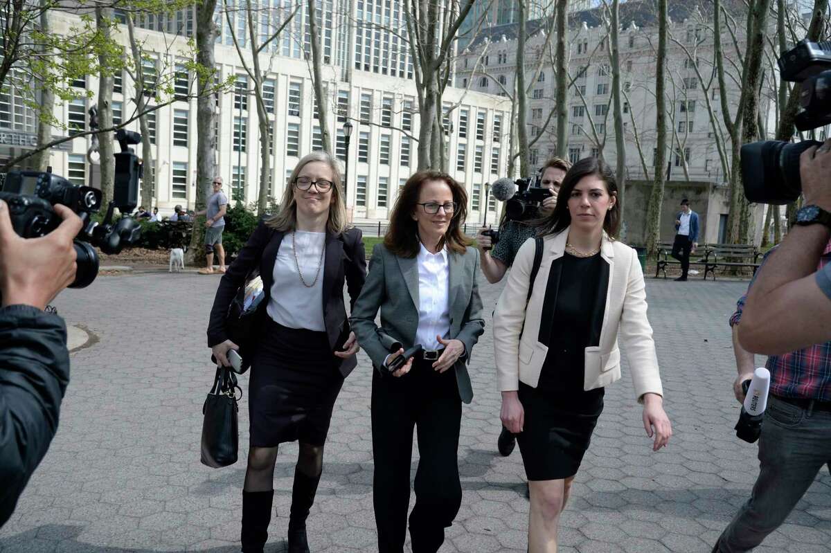 Kathy Russell, center, one of the defendants in the NXIVM sex-cult case, leaves Federal District Court in Brooklyn, April 8, 2019. Some women in the organization were part of a secret society in which they were branded with the initials of NXIVM's former leader, Keith Raniere, and forced to have sex with him, federal prosecutors have said.