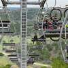 A ski lift whisks cyclists and their bikes uphill at new Spider Mountain near Burnet,