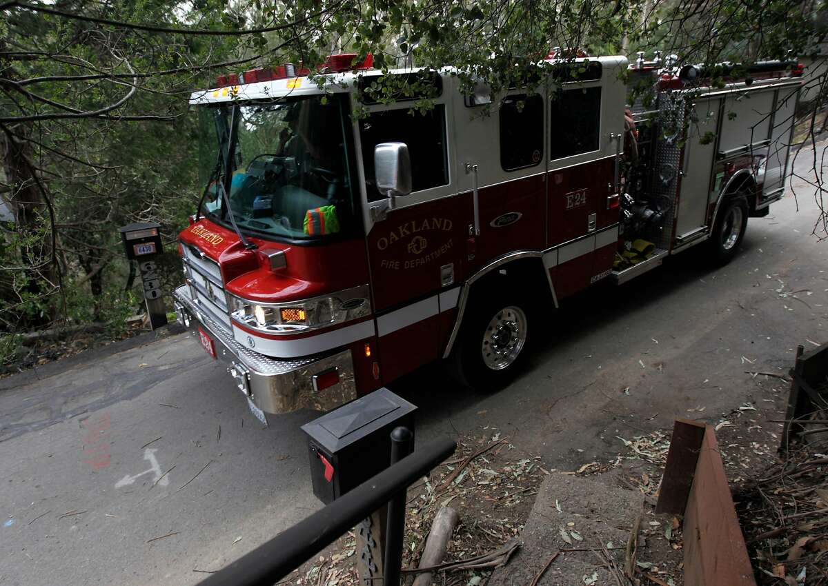 An Oakland Fire Department truck, specially outfitted for hilly roads, patrols on a narrow section of Valley View Road in Oakland, Calif. on Tuesday, Nov. 26, 2013. Despite the lessons learned from the 1991 Oakland Hills Fire, some residents continue to park vehicles in narrow sections of the road, making it difficult for emergency responders to pass.