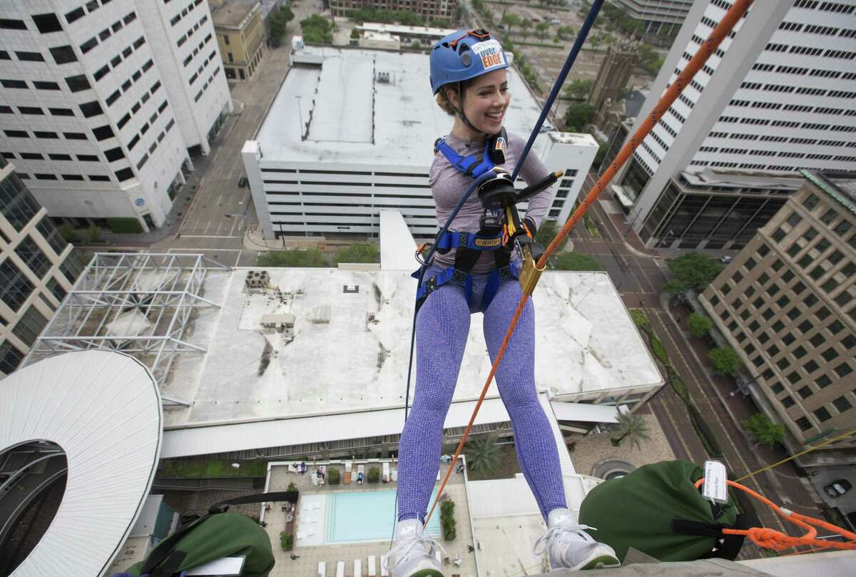 Faith Malton is excited to propel down from the 21st floor of Hotel Alessandra on Saturday, April 13, 2019, in Houston. The 22-year-old University of Houston student was born with one arm and participated in the annual fundraiser to raise money for Camp For All.