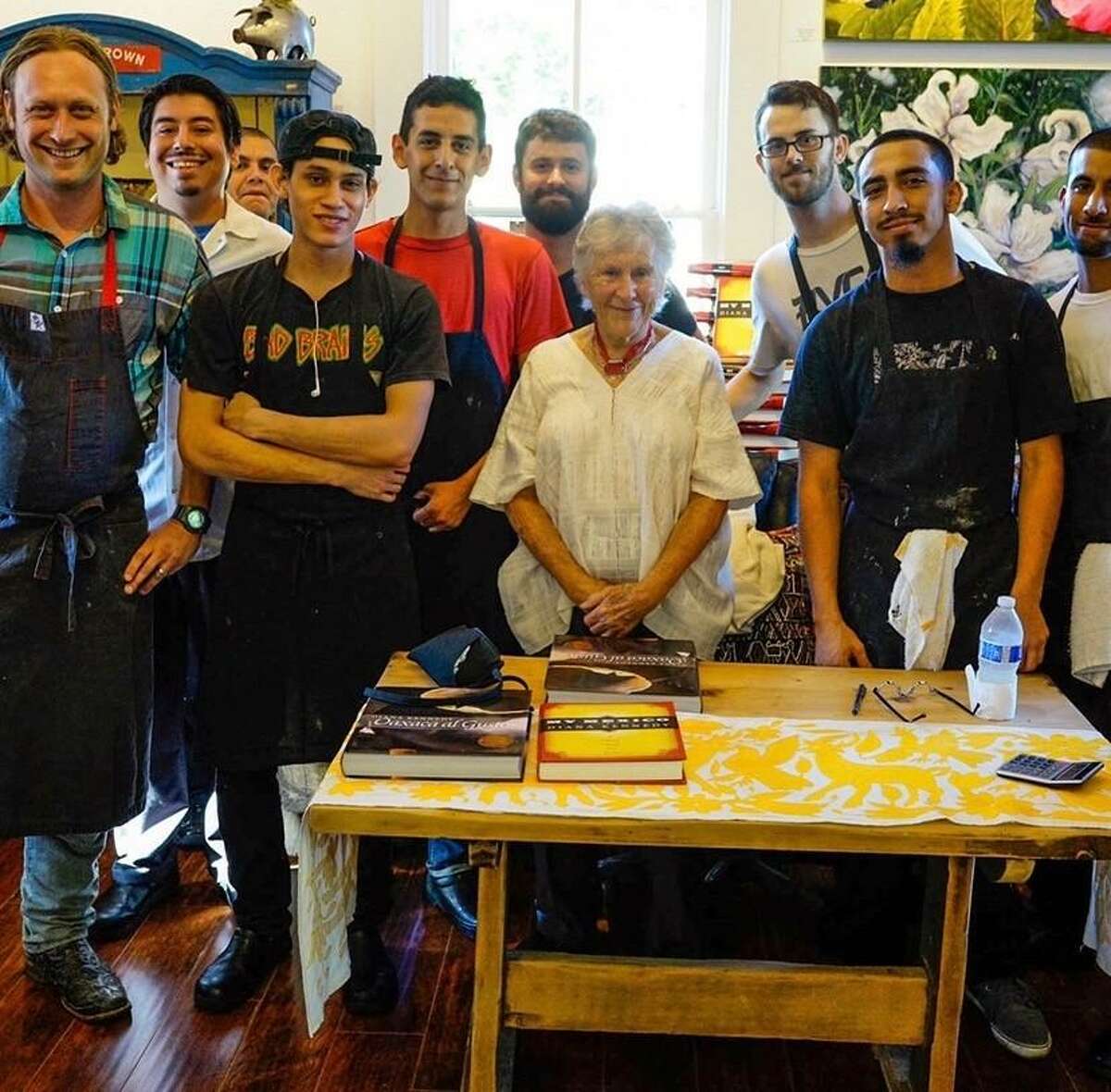 In 2014 San Antonio chef Stefan Bowers (left) and the kitchen staff of his restaurant Feast left a busy line to meet author Diana Kennedy (center, in white), who was signing books at a nearby store.