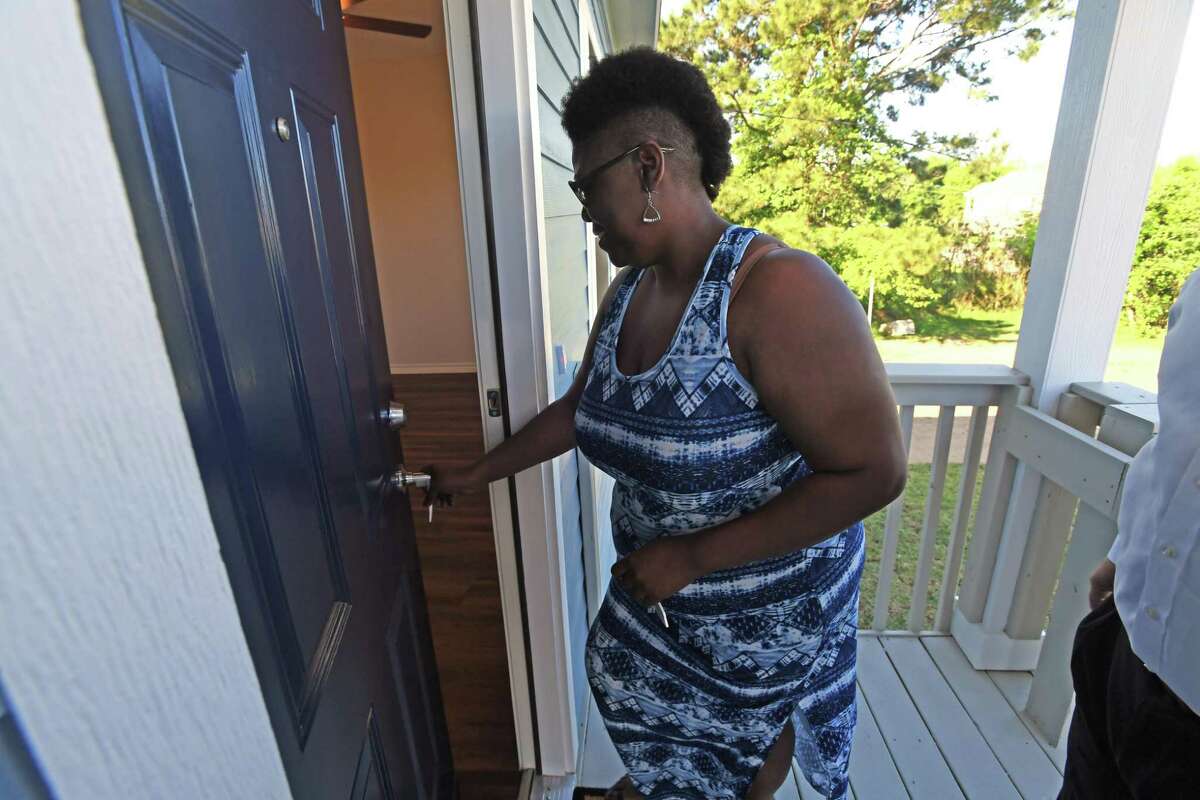 Havalisia Owens walks into her Port Acres home for the first time on Friday. Owens' home was ruined by Harvey, then demolished and replaced by the GLO. Photo taken Friday, 4/19/19