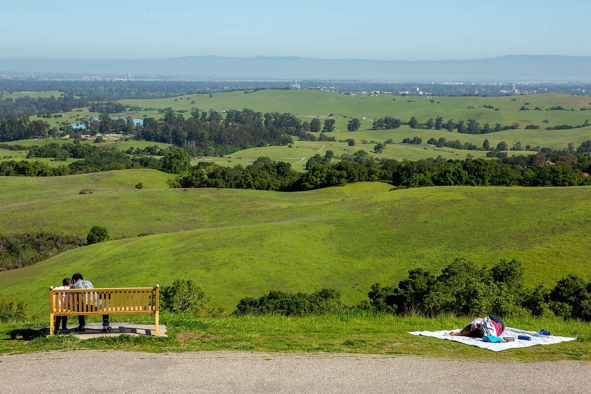 Visitors take in the scene from Foothills Park on Thursday, April 18, 2019, in Palo Alto, Calif.