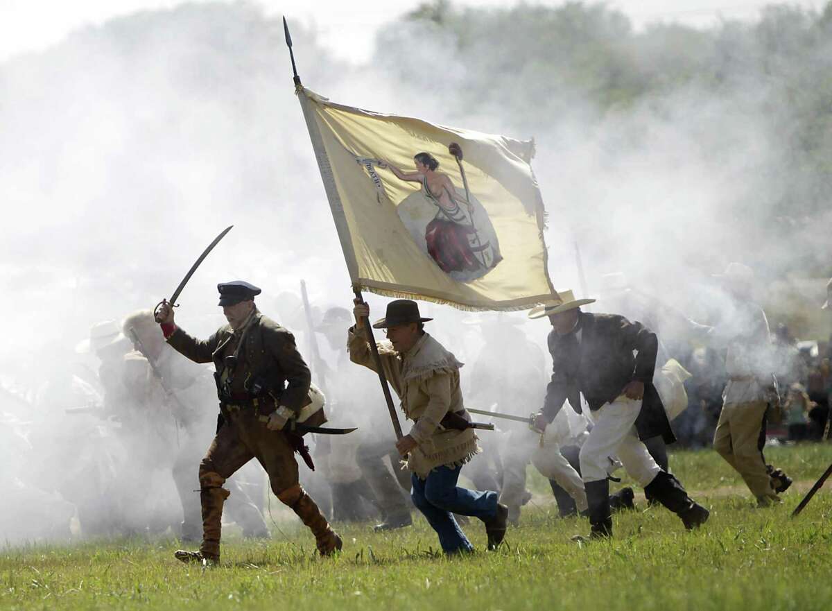 Re-enactors playing the parts of members of the Texian Army, charge toward the Mexican encampment during the Battle of San Jacinto on the grounds of the San Jacinto Battleground, Saturday, April 16, 2011, in Houston, as hundreds of history reenactors recreate the events leading up to and including the Battle of San Jacinto. The monument and state park closed for six weeks after a chemical holding plant caught fire on March 17, 2019, losing more than 70,000 visitors and $200,000.