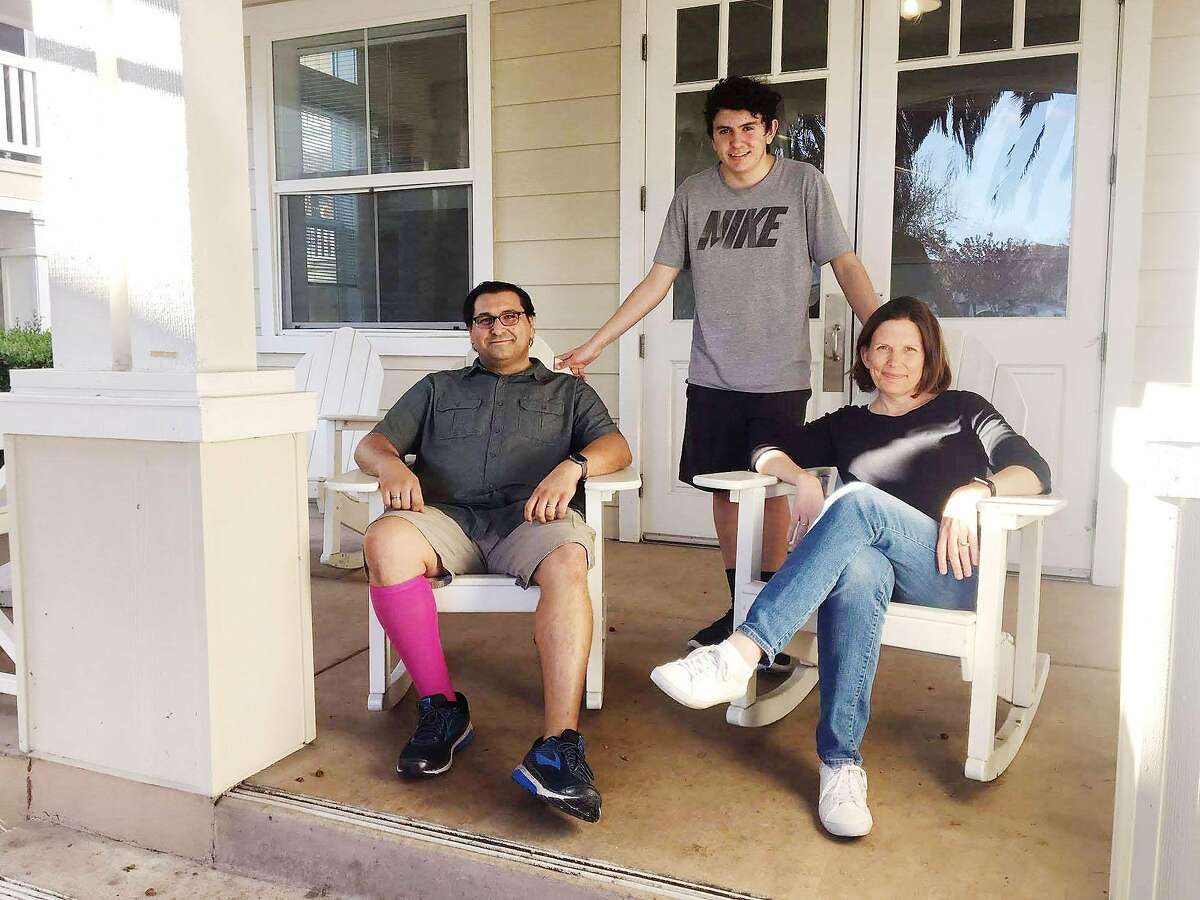 The Valentini family � Loren, a substitute teacher, Alex, a high school sophomore at Wilcox High, and Suzy, an elementary teacher at Santa Clara Unified � on the porch of the meeting hall at Casa del Maestro, the residential complex that the district built for teachers at below-market rents. Teachers and their families can live there for seven years.