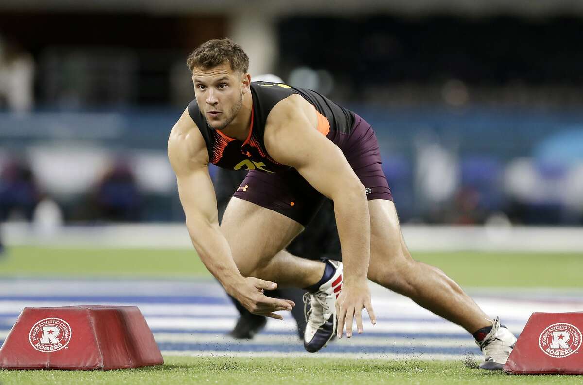 FILE - In this March 3, 2019, file photo, Ohio State defensive lineman Nick Bosa runs a drill during the NFL football scouting combine, in Indianapolis. Bosa is a possible pick in the 2019 NFL Draft. (AP Photo/Darron Cummings, FILE)