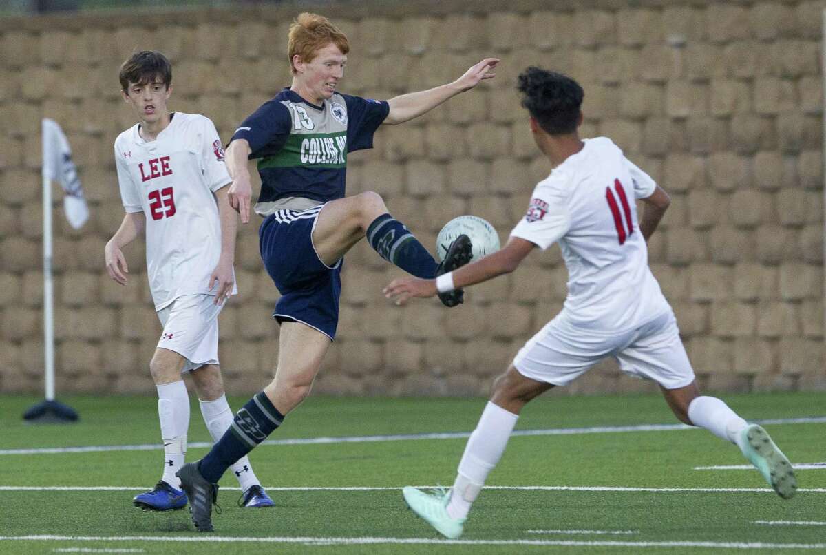 College Park midfielder Jonathan Letai (13) controls the ball in front of San Antonio LEE midfielder Jonathan Facio (11) in the first period of a Class 6A boys state semifinal match during the UIL State Soccer Championships at Birkelbach Field, Friday, April 19, 2019, in Georgetown.