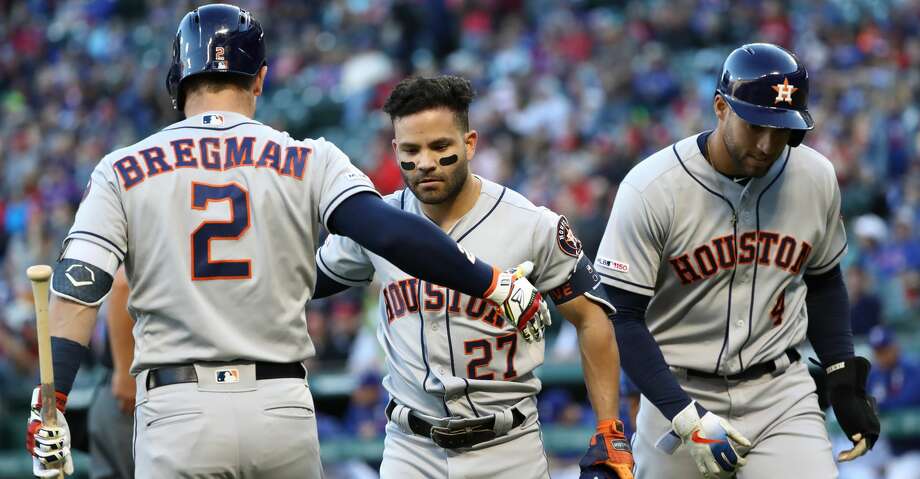 ARLINGTON, Texas - April 19: Jose Altuve, No. 27 of the Houston Astros, celebrates a two-run homer with Alex Bregman, No. 2 of the Houston Astros, in the first leg against the Texas Rangers at Globe Life Park in Houston. Arlington, April 19, 2019. Arlington, Texas. (Photo by Ronald Martinez / Getty Images) Photo: Ronald Martinez / Getty Images