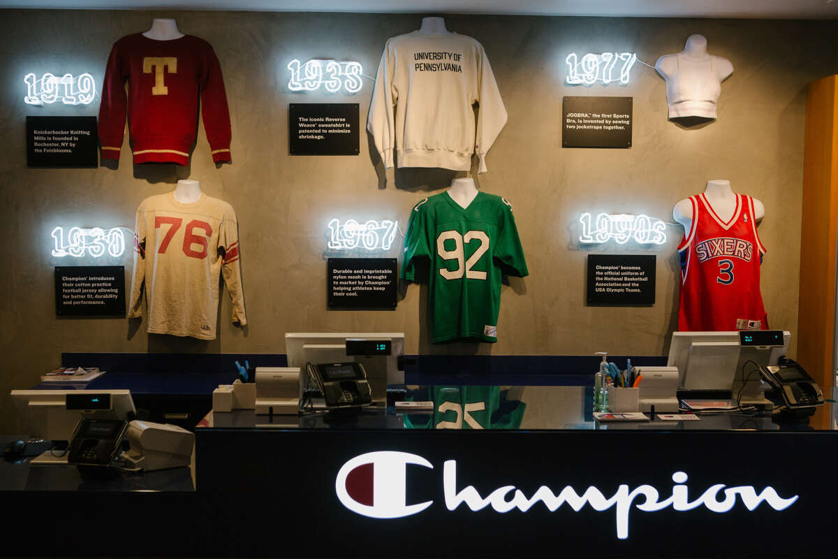 A historical timeline of Champion apparel is displayed at the company's store in Philadelphia on April 10, 2019.