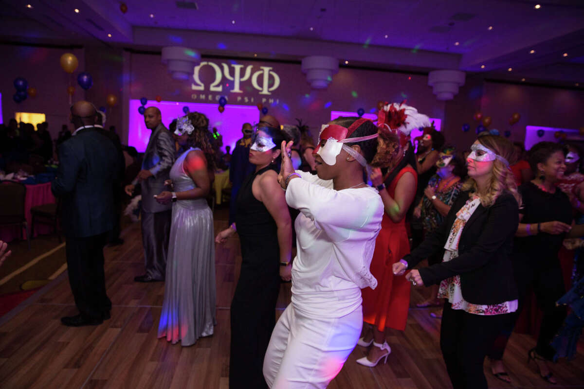 Photos Masks revealed a Fiesta mood at the annual Masquerade Party