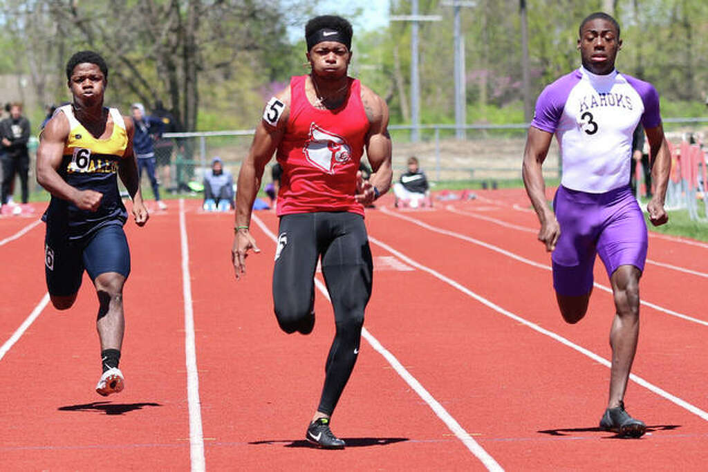 <p>Alton’s Deonte McGoy (middle) beats Collinsville’s Jermarrion Stewart (right) and O’Fallon’s Dorian Brown to the finish in the 100 meters Saturday at the Winston Brown Invitational track meet in</p>