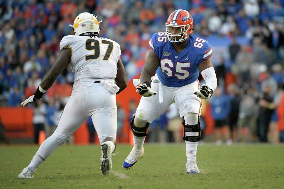 FILE - In this Nov. 3, 2018, file photo, Florida offensive lineman Jawaan Taylor (65) sets up to block against Missouri defensive lineman Akial Byers (97) during the second half of an NCAA college football game, in Gainesville, Fla. Taylor is a possible pick in the 2019 NFL Draft. (AP Photo/Phelan M. Ebenhack, File)