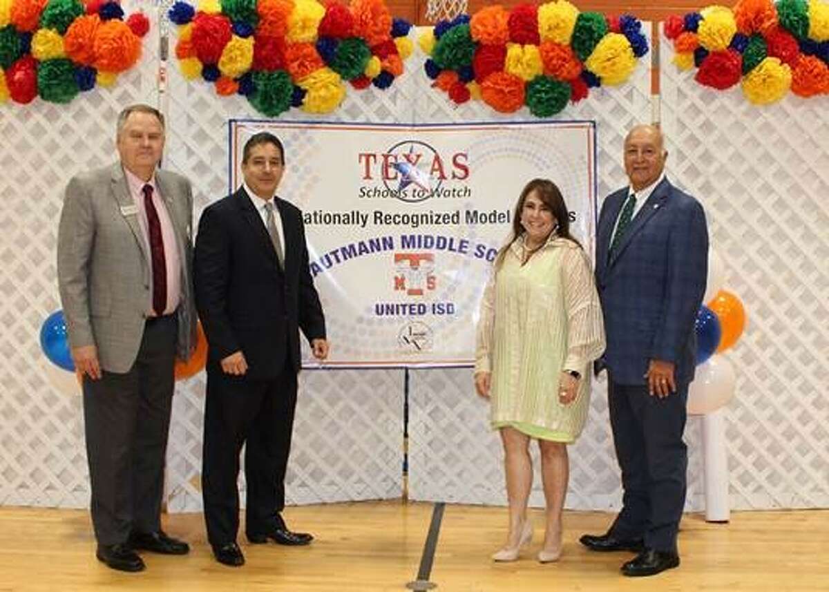 Billy Pringle, state director of Schools to Watch; Javier Montemayor, UISD board member; Leticia Menchaca, Trautmann Middle School principal; and Roberto J. Santos, UISD superintendent, pose for a photo at the Texas Schools To Watch recognition ceremony.