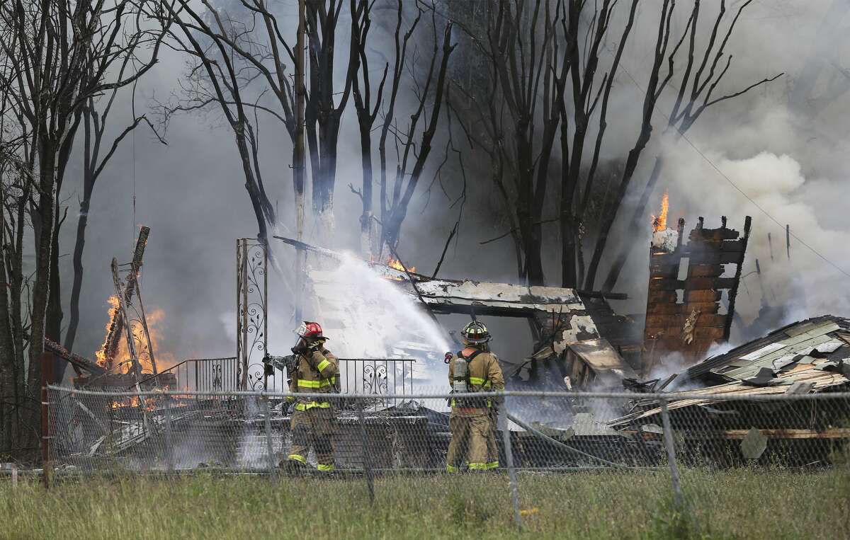 Firefighters work to control a fire at 200 Beldon Avenue involving SWAT team members on April 16, 2019.