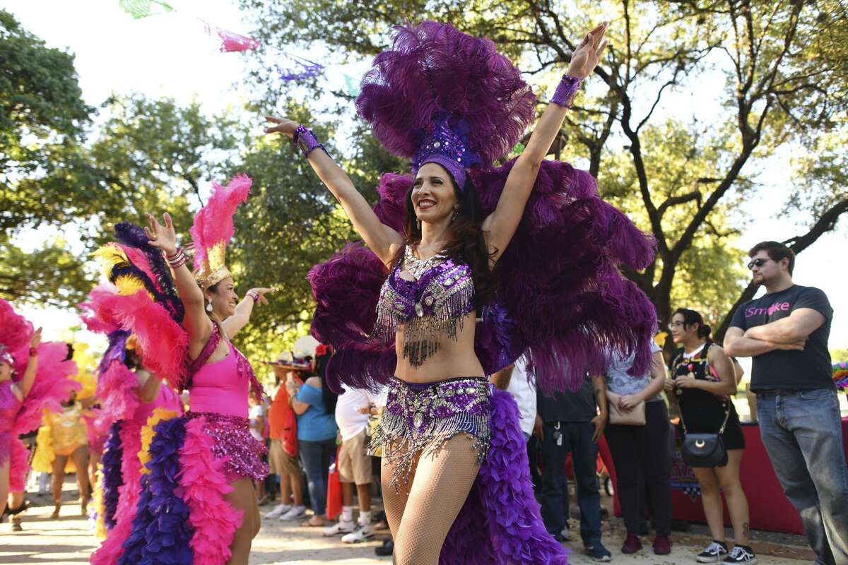 Members of the Samba Vida Drum & Dance Co. parade through Hemisfair Park during the Fiesta Fiesta event on Thursday, April 18, 2019. The event is the official opening of Fiesta.