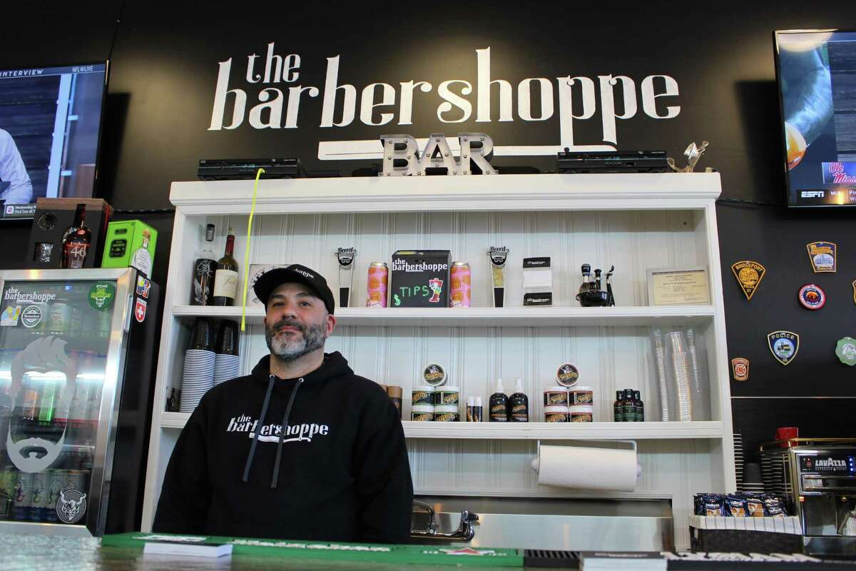 Barbershop with craft beer, vintage video games is ready to give you a hot  towel shave