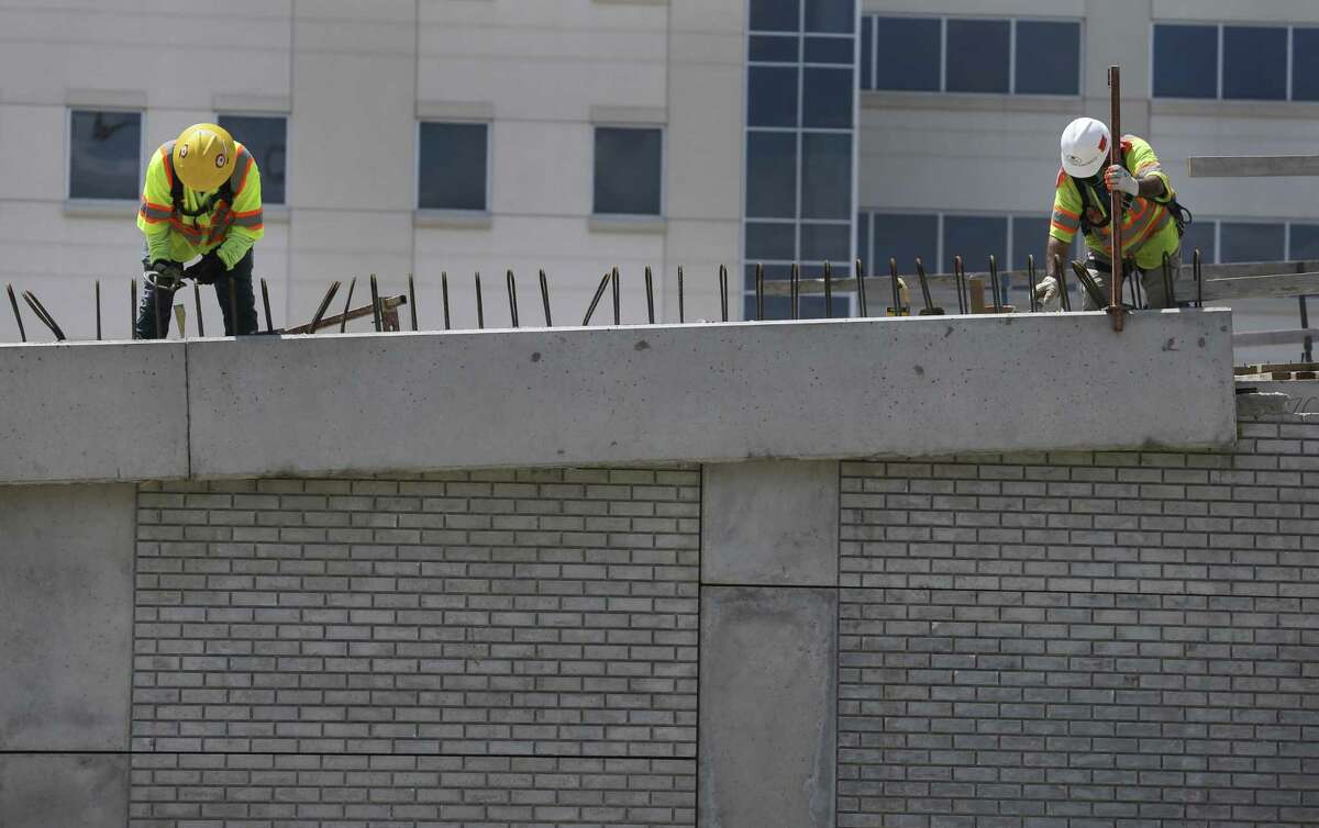 Construction workers tie steel for a barrier on the new ramp south of the Loop 610 interchange with Interstate 69 on April 22. Highway projects, notably interchange rebuilding, is a centerpiece of upcoming transportation spending.