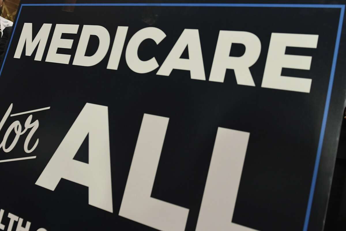 FILE - In this April 10, 2019 file photo, a sign is shown during a news conference to reintroduce "Medicare for All" legislation, on Capitol Hill in Washington. The financial condition of the government’s bedrock retirement programs for middle- and working-class Americans remain shaky, with Medicare pointed toward insolvency by 2026. That’s the word from the latest report by the government’s overseers of Medicare and Social Security, which paints a sobering picture of the programs, though it’s relatively unchanged from last year’s update. Social Security would become insolvent in 2035, one year later than previously estimated. (AP Photo/Susan Walsh)