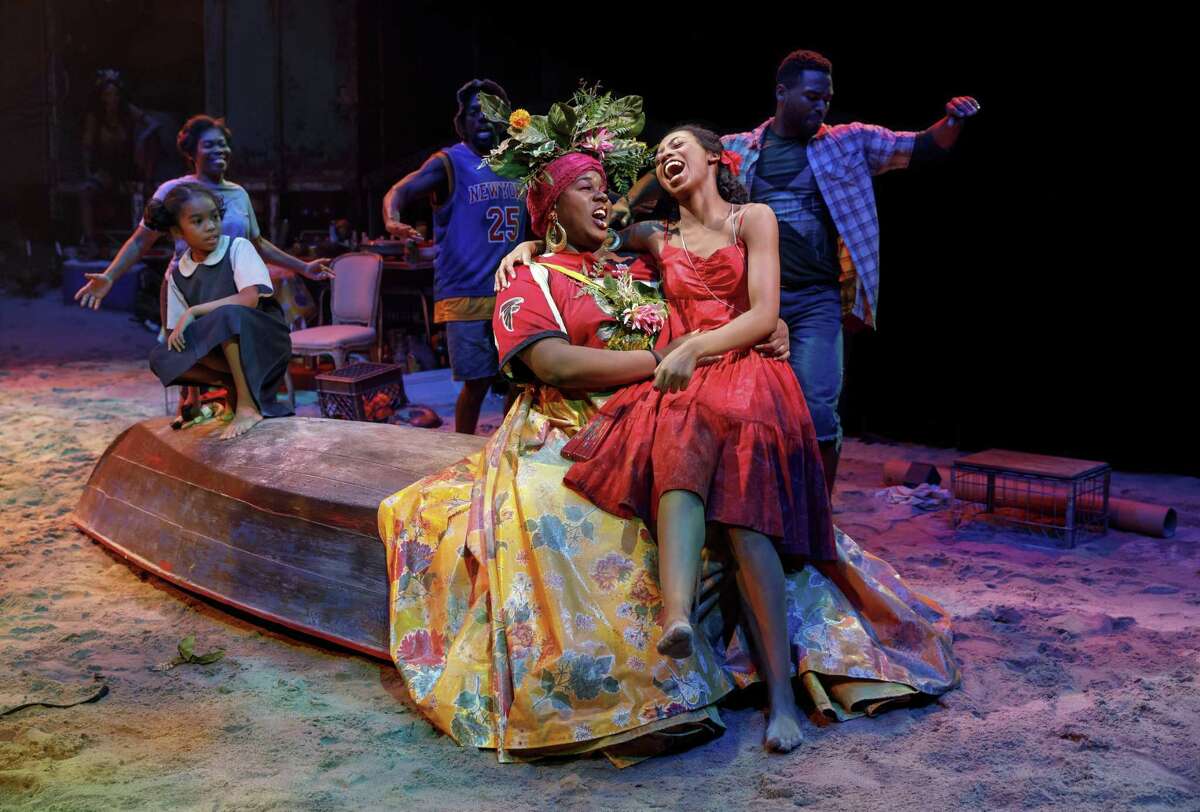Mia Williamson, left on boat, Alex Newell and Hailey Kilgore in “Once On This Island,” coming to the Shubert.