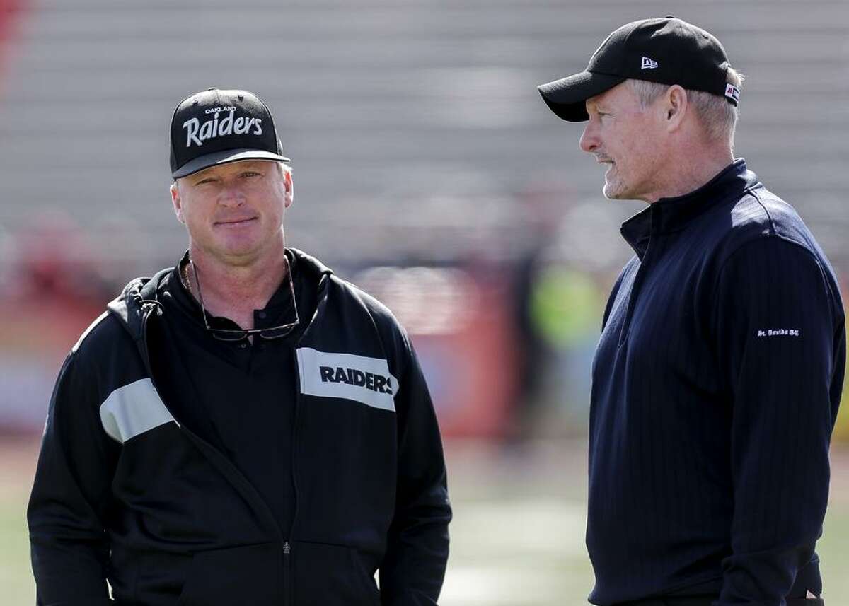MOBILE, AL - JANUARY 26: Head Coach Jon Gruden and General Manager Mike Mayock of the Oakland Raiders of the North Team talk before the start of the 2019 Reese's Senior Bowl at Ladd-Peebles Stadium on January 26, 2019 in Mobile, Alabama. The North defeated the South 34 to 24.
