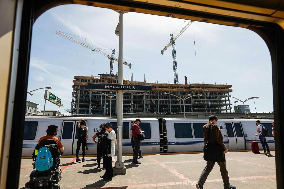 An apartment building is seen under construction from the MacArthur BART station in Oakland, California, on Tuesday, April 23, 2019.