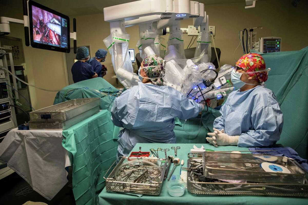 Surgeons carry out a surgery with a da Vinci Xi robotic surgical system at the Robert-Debre Hospital in Paris, on April 5, 2019. - Despite debates over the added value relative to their cost, surgical robots are on the rise. In the past 20 years the pioneer and world leader in the sector US group Intuitive Surgical has already installed more than 4,800 robots of its da Vinci range in the world, including 144 in France. Its robots have already been involved in more than 6 million surgical procedures worldwide, including one million just last year, a clear sign of the sharp acceleration of demand. (Photo by Thomas SAMSON / AFP)THOMAS SAMSON/AFP/Getty Images
