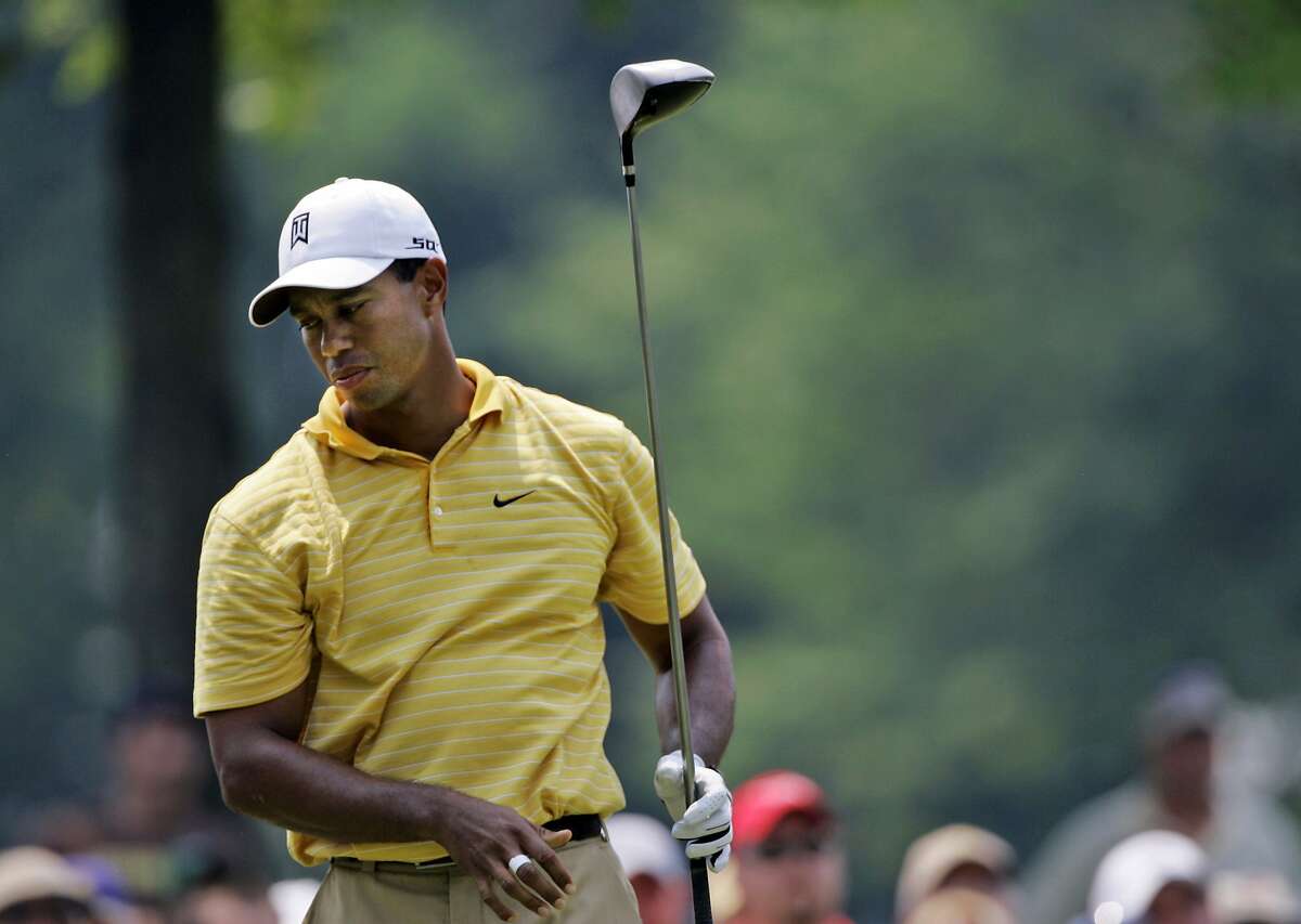 Tiger Woods looks away after this tee shot on the ninth hole at Firestone Country Club in Akron, Ohio, during the first round of the Bridgestone Invitational golf tournament Thursday, Aug. 2, 2007. Woods is one shot back at 2-under par. (AP Photo/Amy Sancetta)