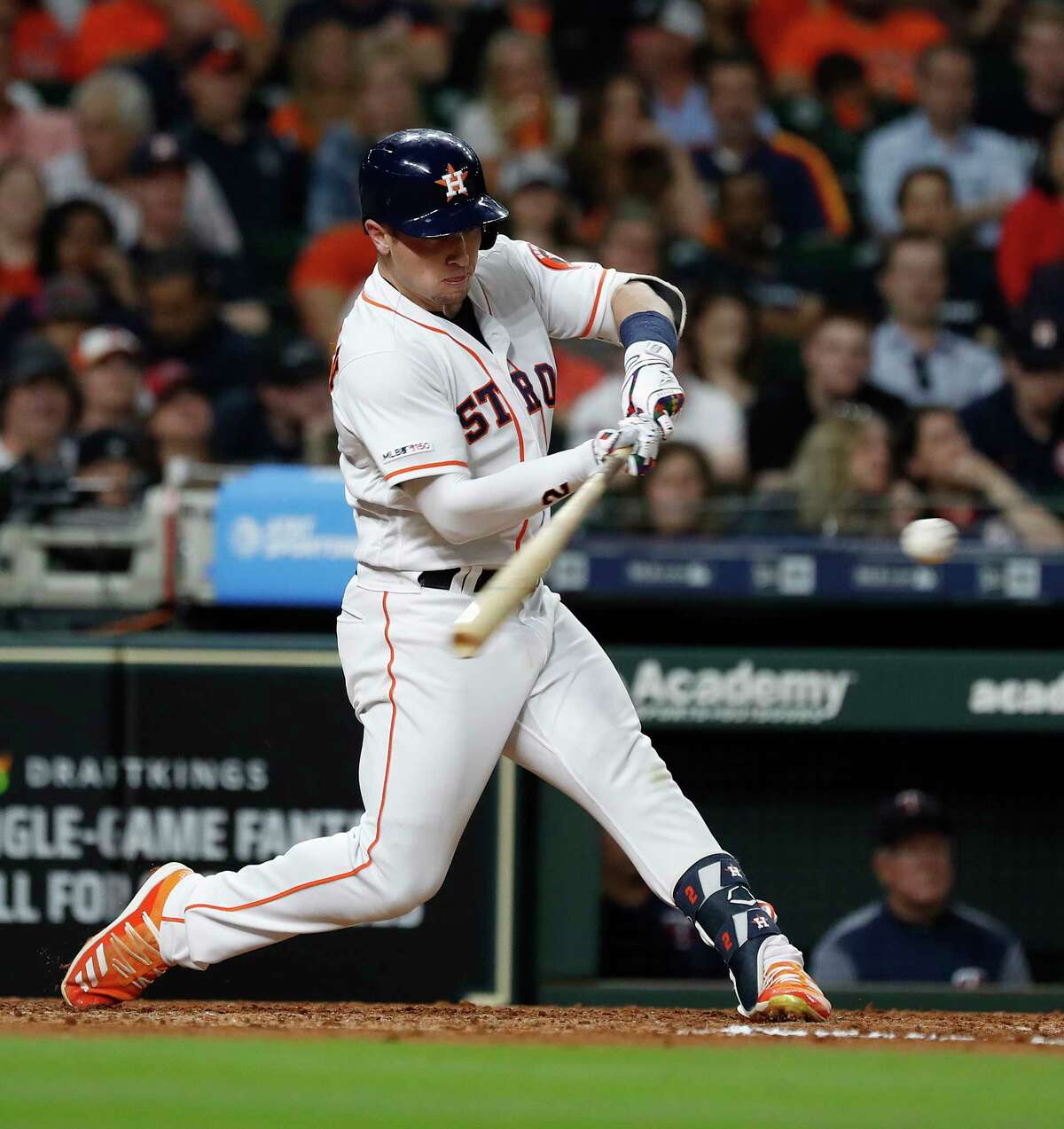 Houston Astros third baseman Alex Bregman (2) hits his RBI single during the fifth inning of an MLB baseball game at Minute Maid Park, Tuesday, April 23, 2019, in Houston.