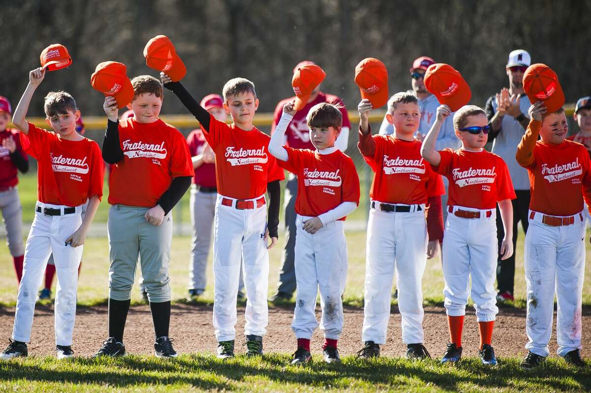 Fraternal Northwest Little League teams gather for an opening day ceremony on Tuesday, April 23, 2019 at the Sturgeon Road complex in Midland. (Katy Kildee/kkildee@mdn.net)