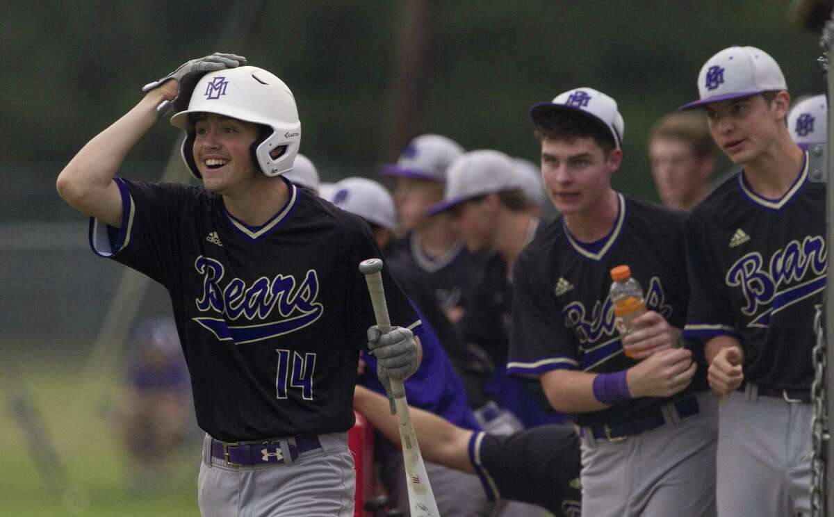 Charlie Taylor #14 of Montgomery smiles as Tristan Whitehead scores on Dalton Davis’ RBI double during the third inning of a District 20-5A high school baseball game at Caney Creek High School, Tuesday, April 23, 2019, in Grangerland.