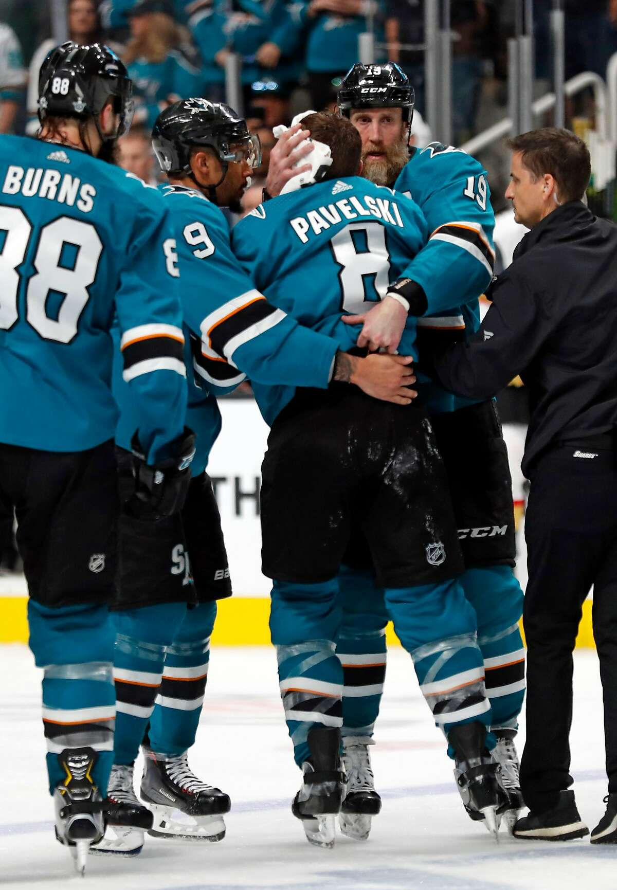 San Jose Sharks' Joe Thornton helps an injured Joe Pavelski ioff the ice in 3rd period against Vegas Golden Knights during Game 7 of NHL Western Conference 1st round playoff game at SAP Center in San Jose, Calif., on Tuesday, April 23, 2019.