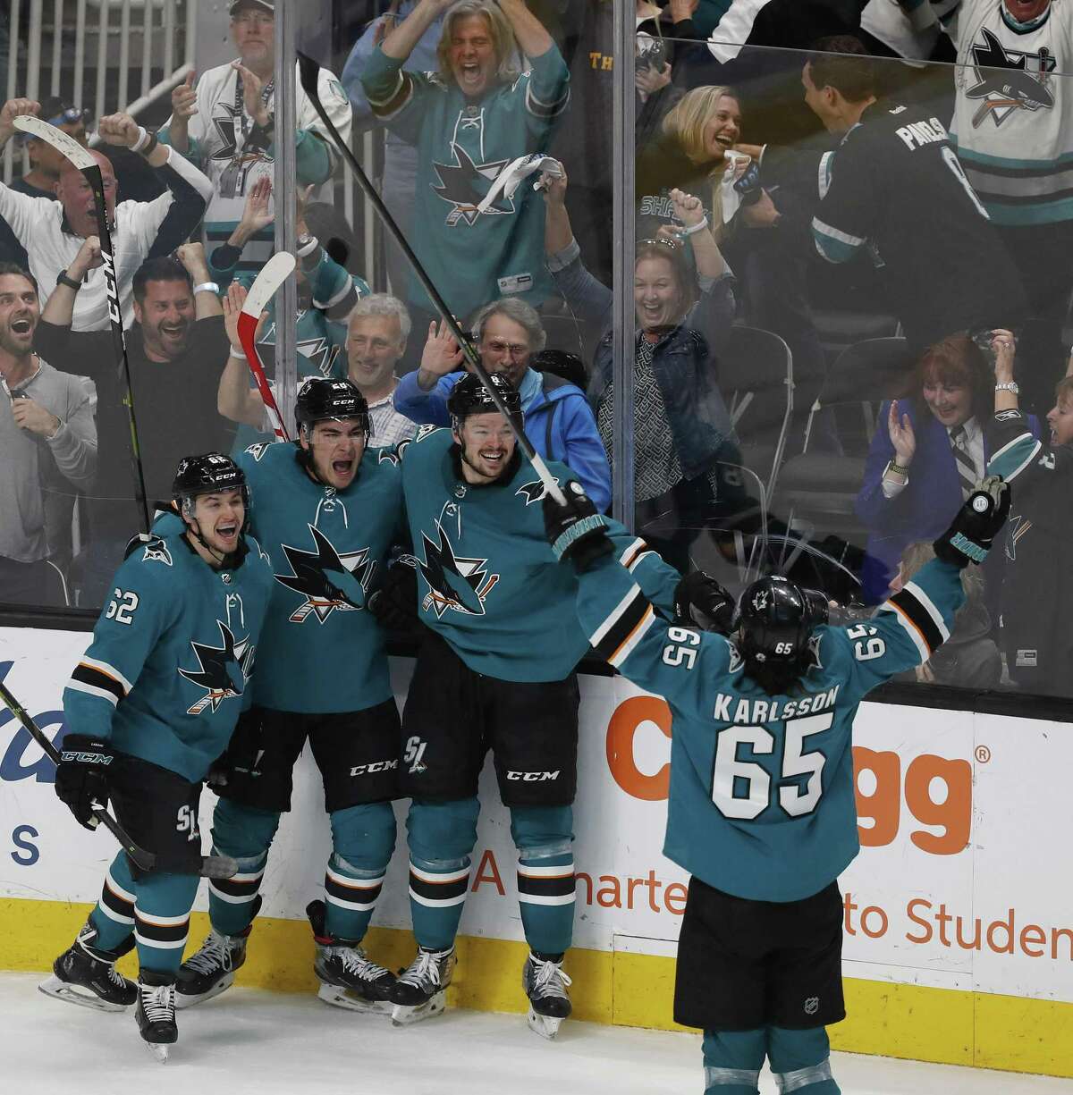 San Jose Sharks' Kevin Labanc (62) celebrates with, San Jose Sharks' Timo Meier (28), San Jose Sharks' Tomas Hertl (48), San Jose Sharks' Erik Karlsson (65) after scoring against the Vegas Golden Knights during the third period of Game 7 of an NHL hockey first-round playoff series Tuesday, April 23, 2019, in San Jose, Calif.