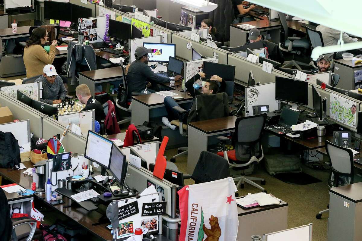 Several Rackers break for lunch at their desks on Wednesday, March 6, 2019.
