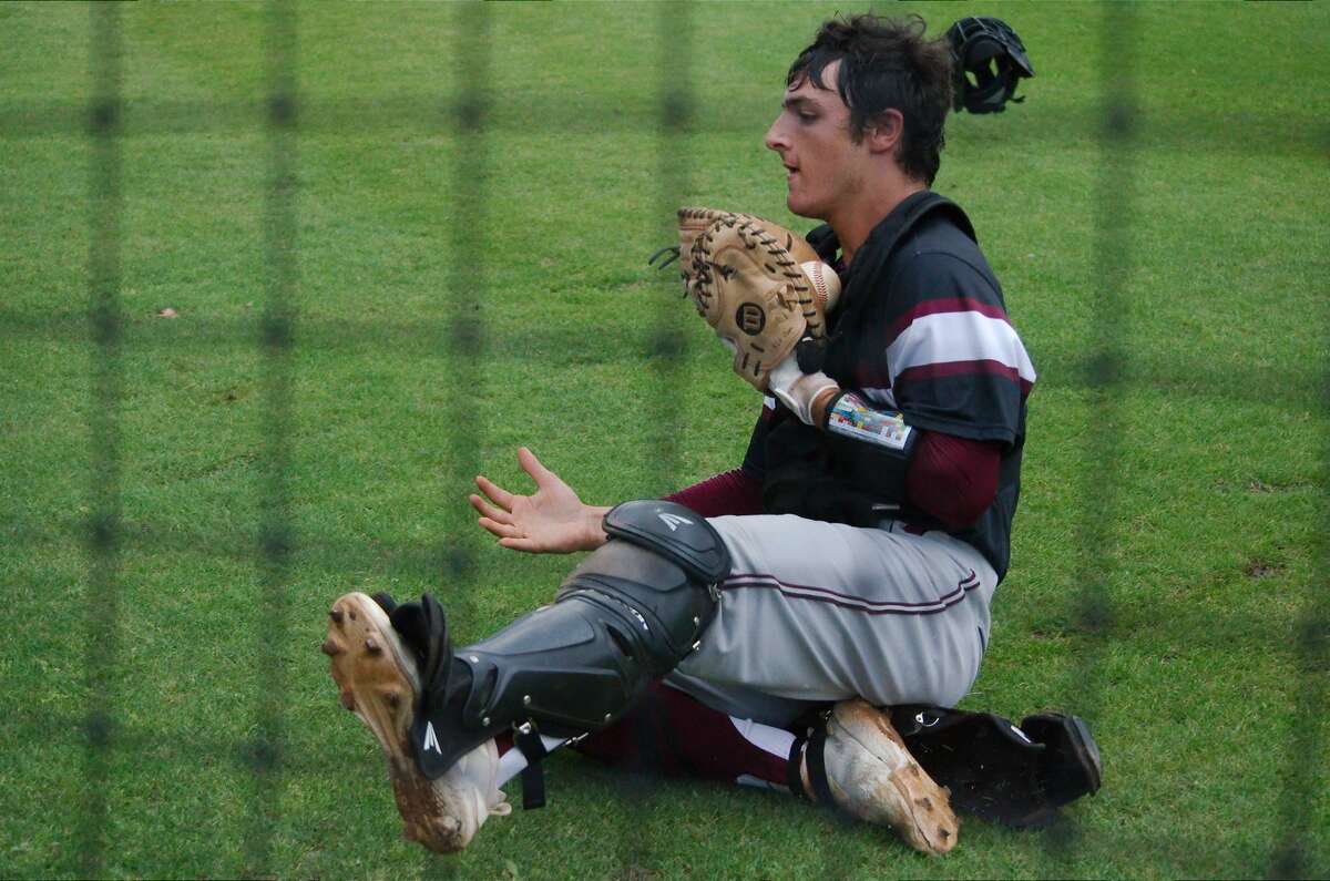 Clear Creek's Andrew Cardi (10) slides to catch a foul ball for an out against Clear Springs Tuesday, Apr. 23 at Clear Springs High School.