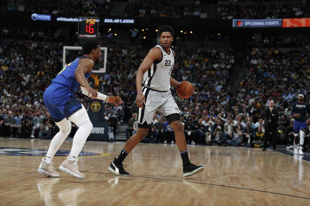 Denver Nuggets guard Malik Beasley (25) and San Antonio Spurs forward Rudy Gay (22) in the first half of Game 5 of an NBA basketball first-round playoff series Tuesday, April 23, 2019, in Denver. (AP Photo/David Zalubowski)
