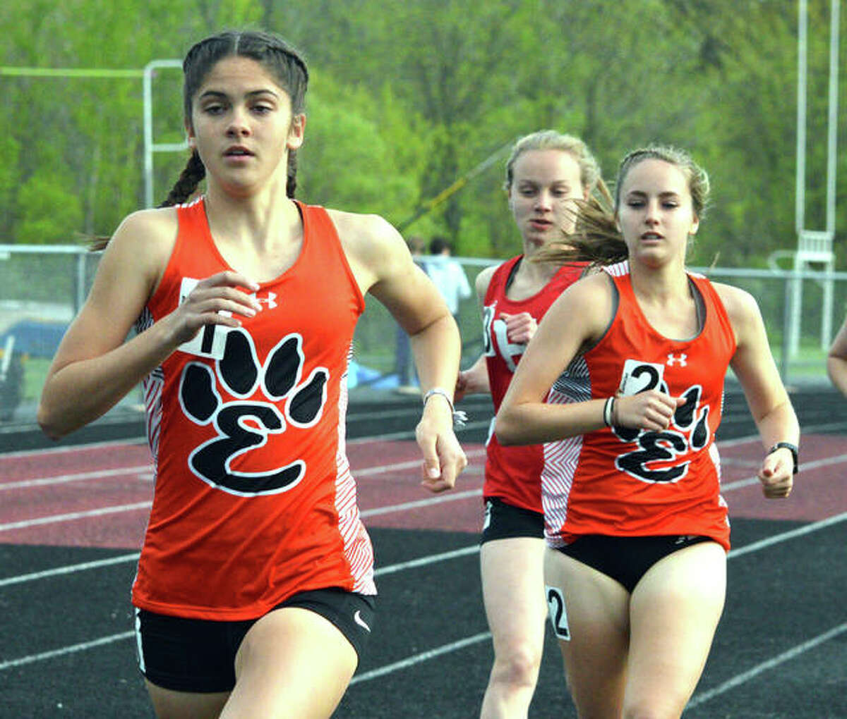 Edwardsville’s Abby Korak runs in front of the pack, including teammate Hannah Stuart, on Tuesday in the Madison County Meet in Troy.
