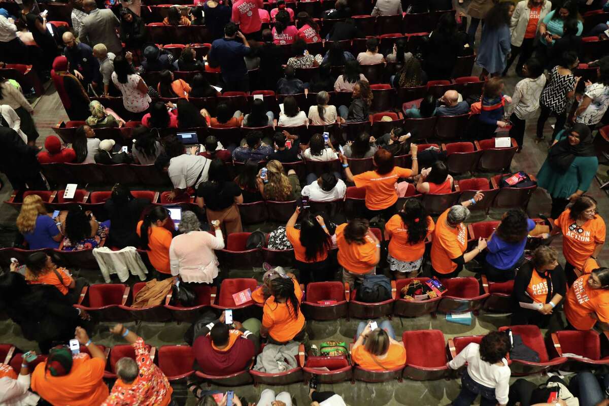 Attendees dance and relax during intermission at the She The People, the first-ever Presidential candidate forum focused on issues important to women of color on the campus of Texas Southern University Wednesday, April 24, 2019, in Houston.
