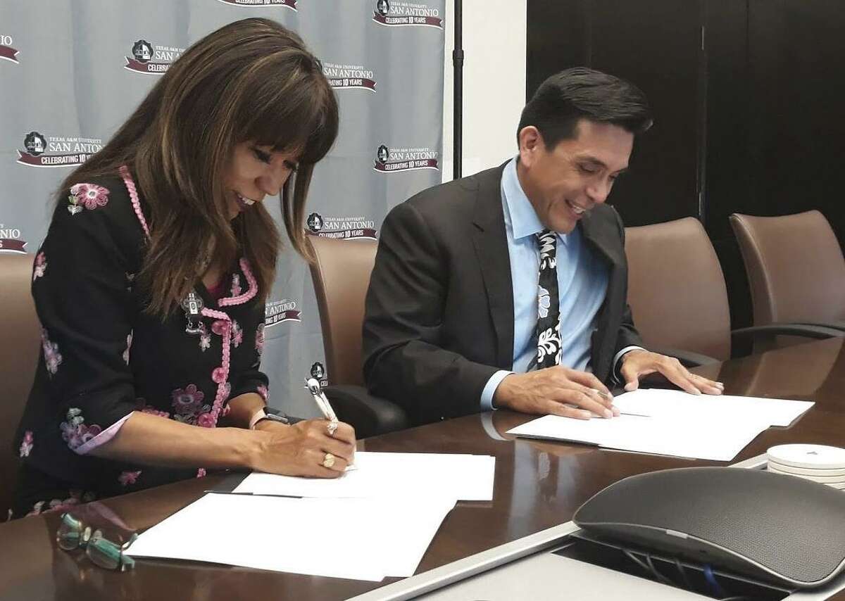 Texas A&M University - San Antonio president Cynthia Teniente-Matson and Tony Diaz, director of Nuestra Palabra: Latino Writers Having Our Say, sign the agreement making the San Antonio campus the home of the Macondo Writers Workshop.