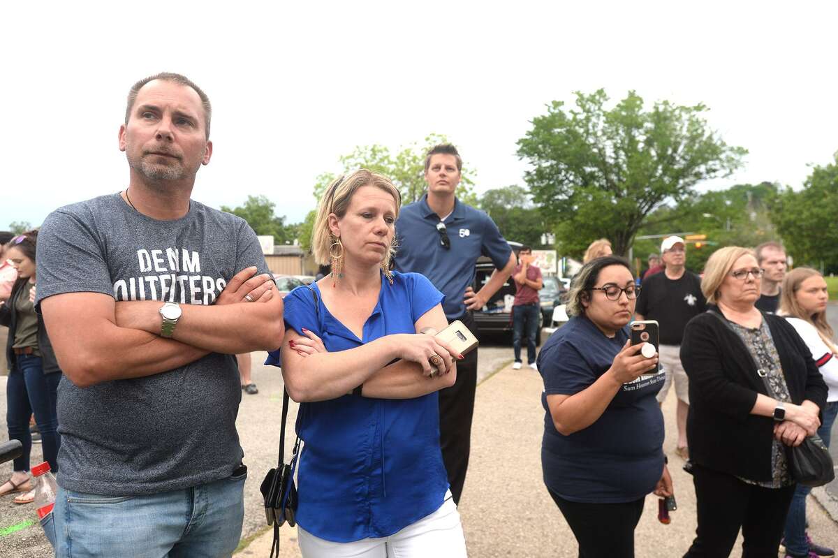 Protesters and observers, including Robert and Ilona VanVeen of the Netherlands (at left), gather outside of the Huntsville Unit where John William King is scheduled to be executed Wednesday. Photo taken Wednesday, April 24, 2019 Kim Brent/The Enterprise