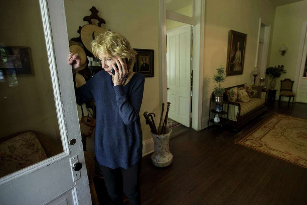 Landowner Mary Thompson talks on the phone in the entryway at Catalpa Plantation on Tuesday, April 2, 2019, in St. Francisville, La. Thompson has leased her land to an oil company for drilling and exploration. The Austin Chalk shale play that stretches from Texas into Louisiana is potentially being seen as a next big oil and gas play for Houston energy companies.