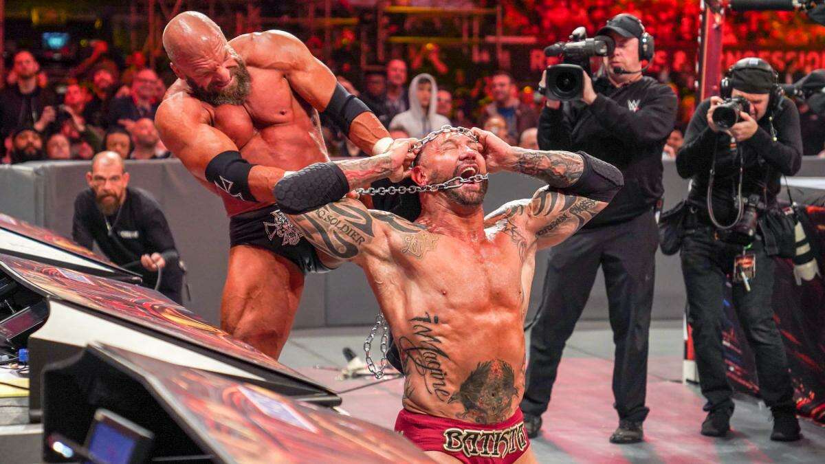 Triple H, left, grapples with Batista during WrestleMania 35 at MetLife Stadium in East Rutherford, New Jersey, on April 7, 2019.