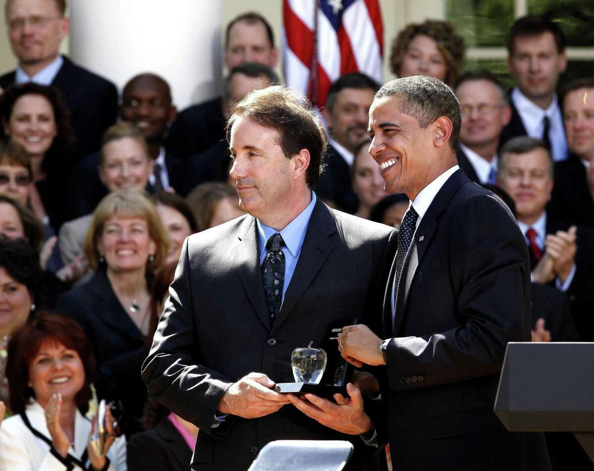 President Barack Obama introduces the 2009 National Teacher of the Year, Anthony Mullen of Greenwich, Conn., during a ceremony in the Rose Garden of the White House in Washington, Tuesday, April 28, 2009.