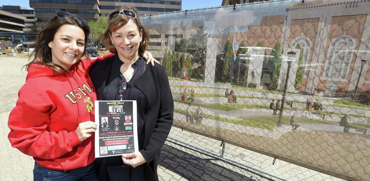 Lisa May Melfi, left, and Patricia D. Parry, both of Stamford, are photograph April 24, 2019 outside the site of Veterans Park in Stamford, Connecticut. A benefit concert set for this May will recognize Connecticut veterans and raise money to assist them. Rock Out for the Red, White and Blue, to be held May 19 at the Palace Theatre in Stamford, is the brain child of Melfi, the daughter of a former U.S. Marine. A portion of the proceeds raised at the event will also be used in supporting the rebuilding of Veterans Park.