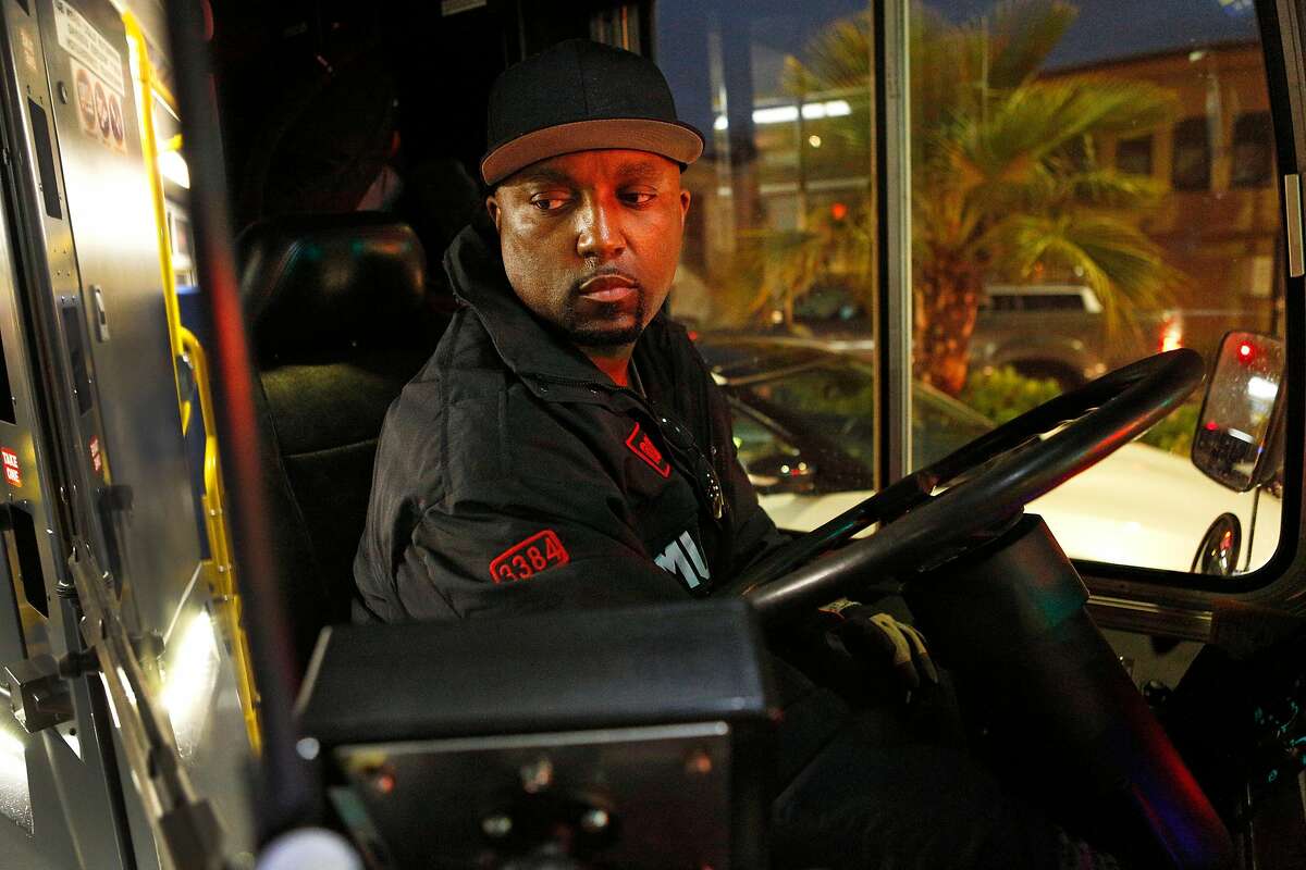 Terry Warmsley watches his passengers as they step off the 27-Bryant bus he is operating on Wednesday, Dec. 5, 2018, in San Francisco, Calif. Warmsley was worked for Muni for 11 years.