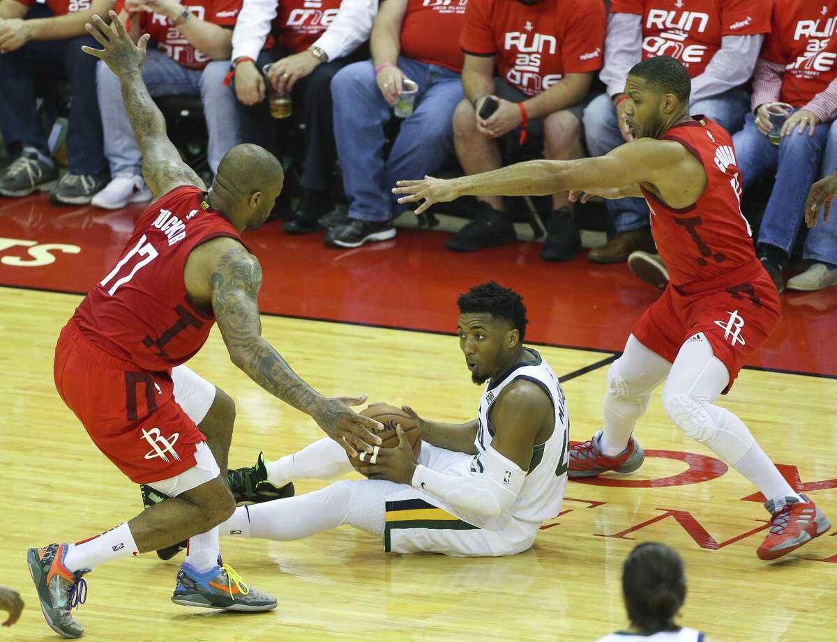 Houston Rockets forward PJ Tucker (17) and guard Eric Gordon (10) defend Utah Jazz guard Donovan Mitchell (45) during Game 5 of an NBA first round playoff series at Toyota Center in Houston, Wednesday, April 24, 2019.